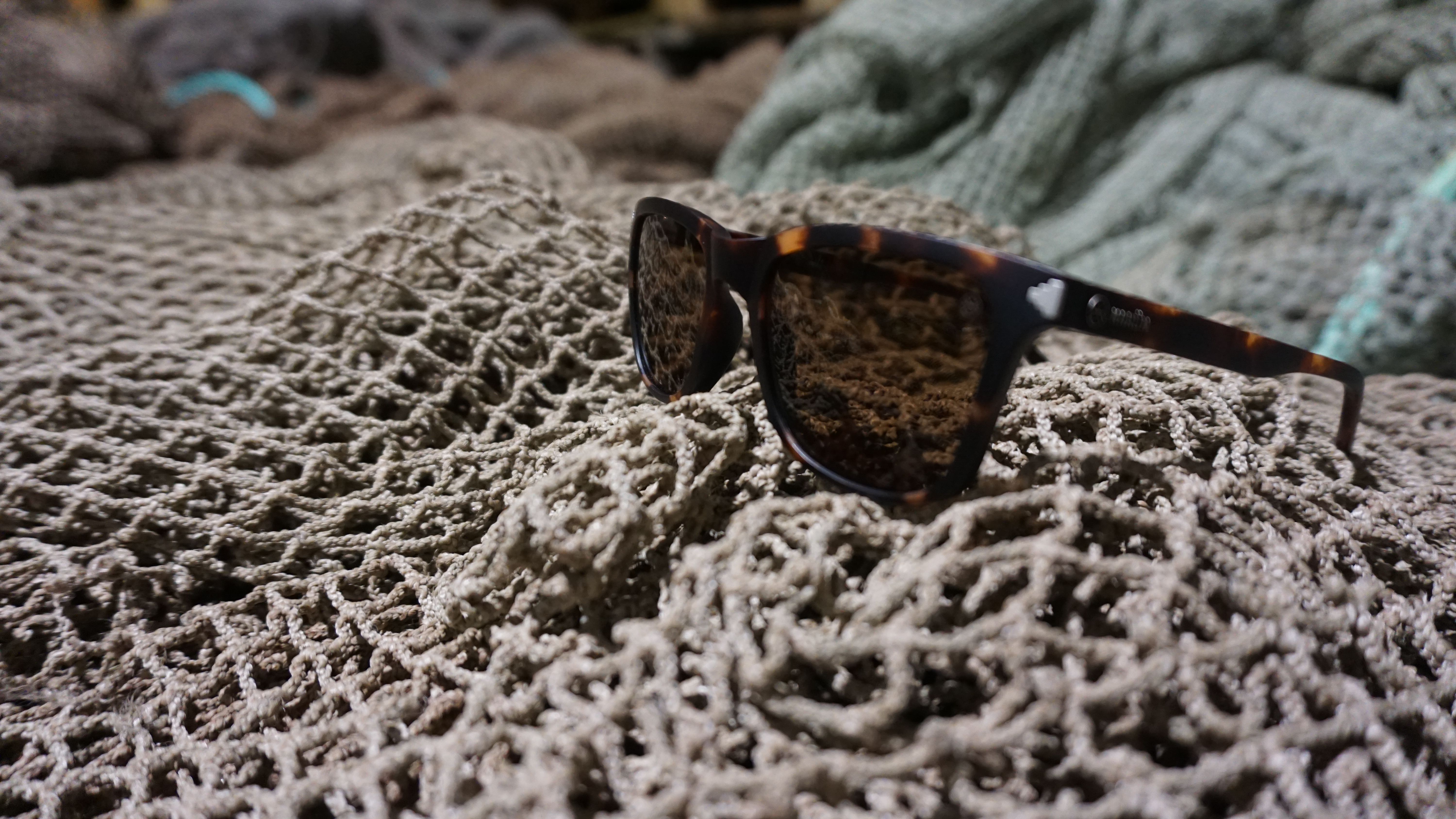 Fishing line in focus with ocean and mountains blurry in the backround